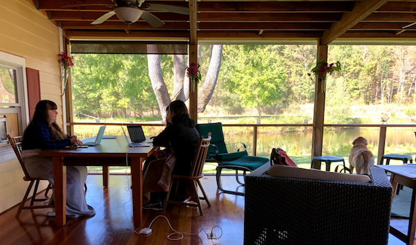 An image of the Olark team working at a table. Once you've started capturing live chats in your CRM, sit with your sales team and determine what your workflows are going to be.